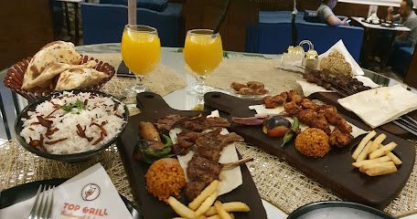 مطعم و لاونج توب قريل قمة - Top Grill Restaurant & Lounge - تبوك - +966 53 322 7383